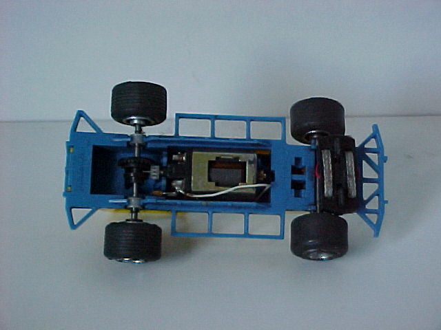 Underside, guide perpendicular to chassis
